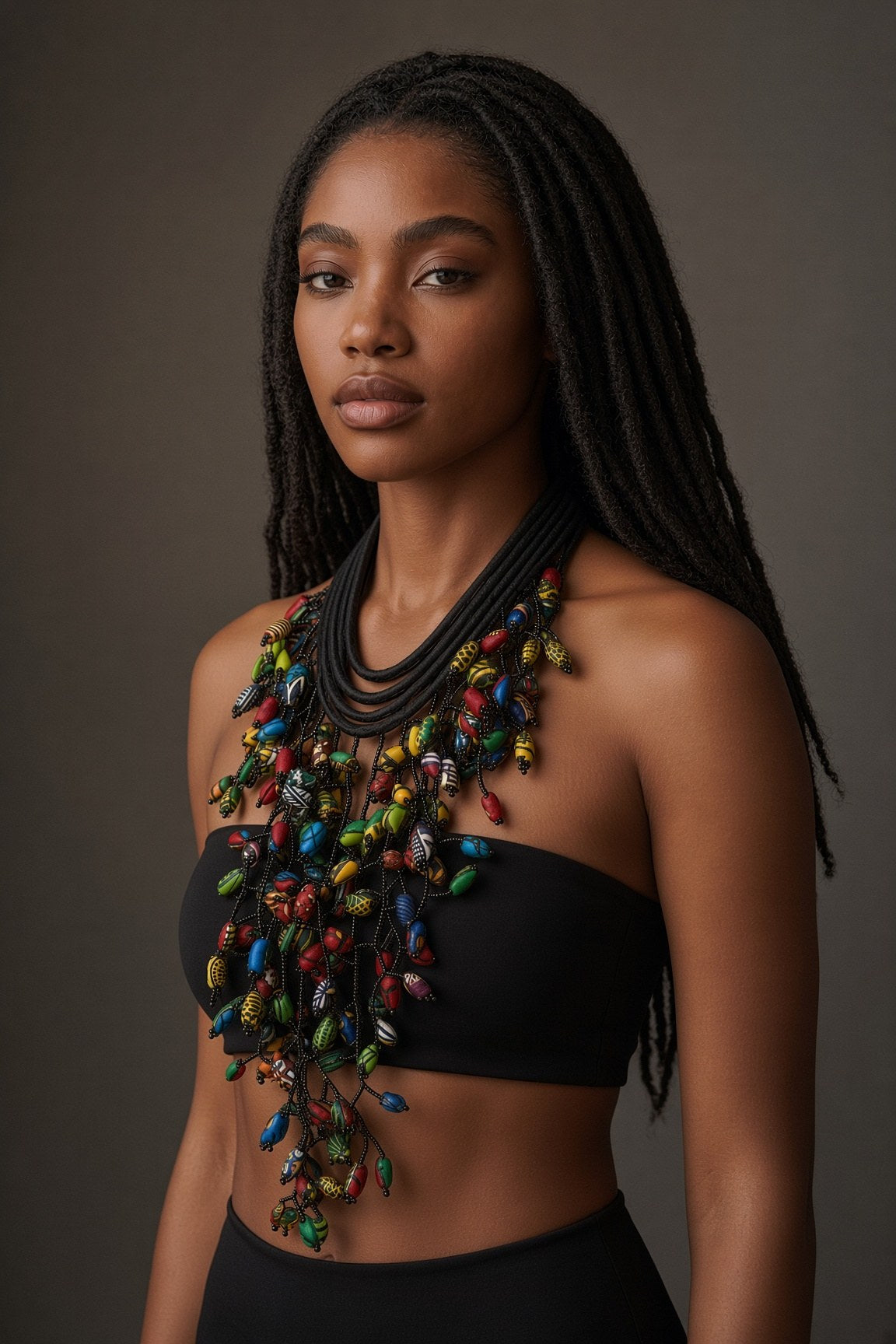 Berness Cascade Necklace — Black Collar with Ankara Fabric Balls worn